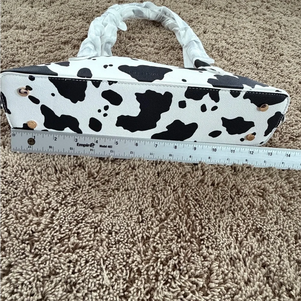 NWT new Anthropologie melie bianco east west shoulder bag cow print black white